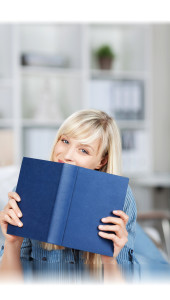 Woman holding a blue book
